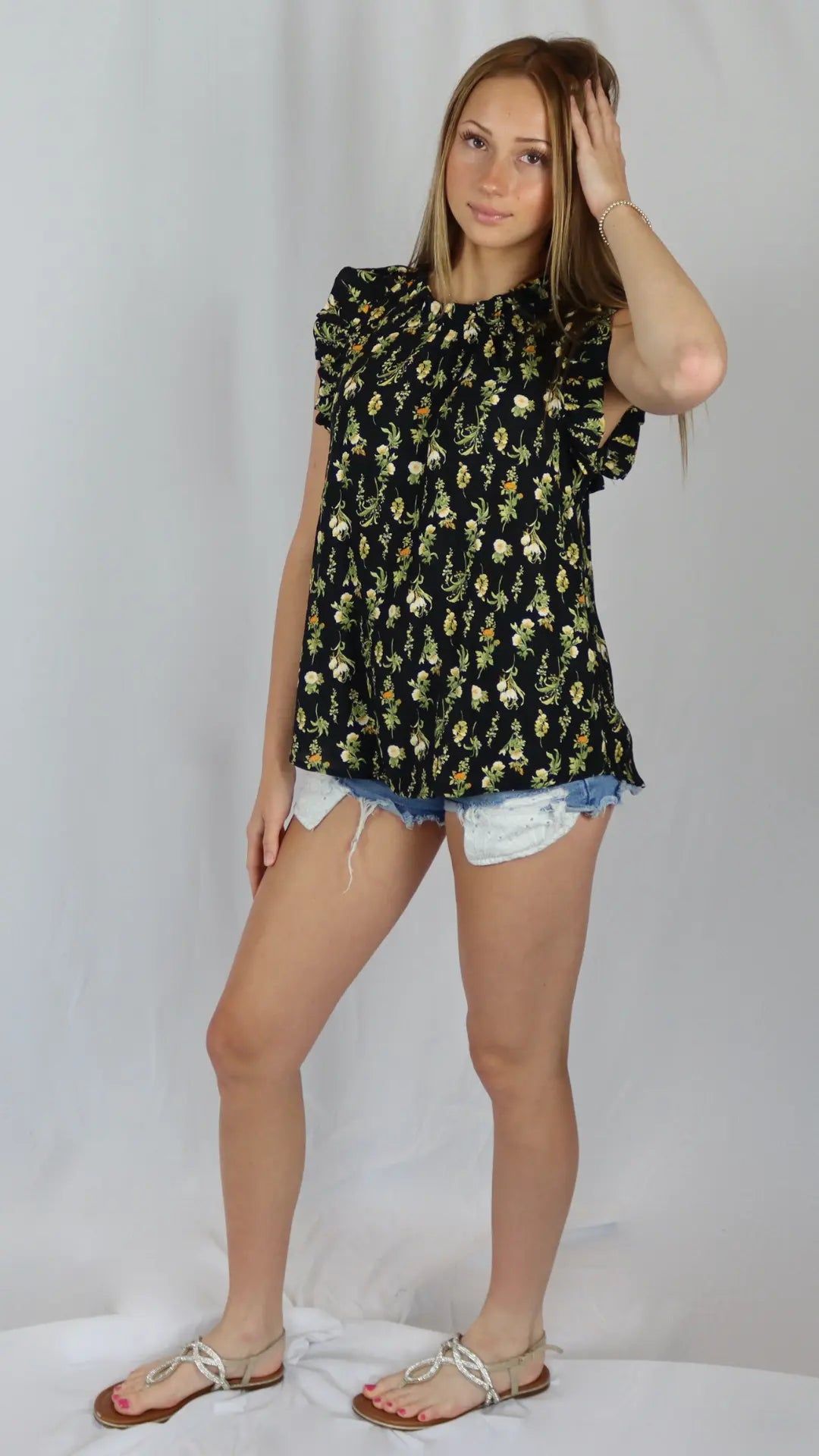 Black floral blouse styled with denim for an easy outfit