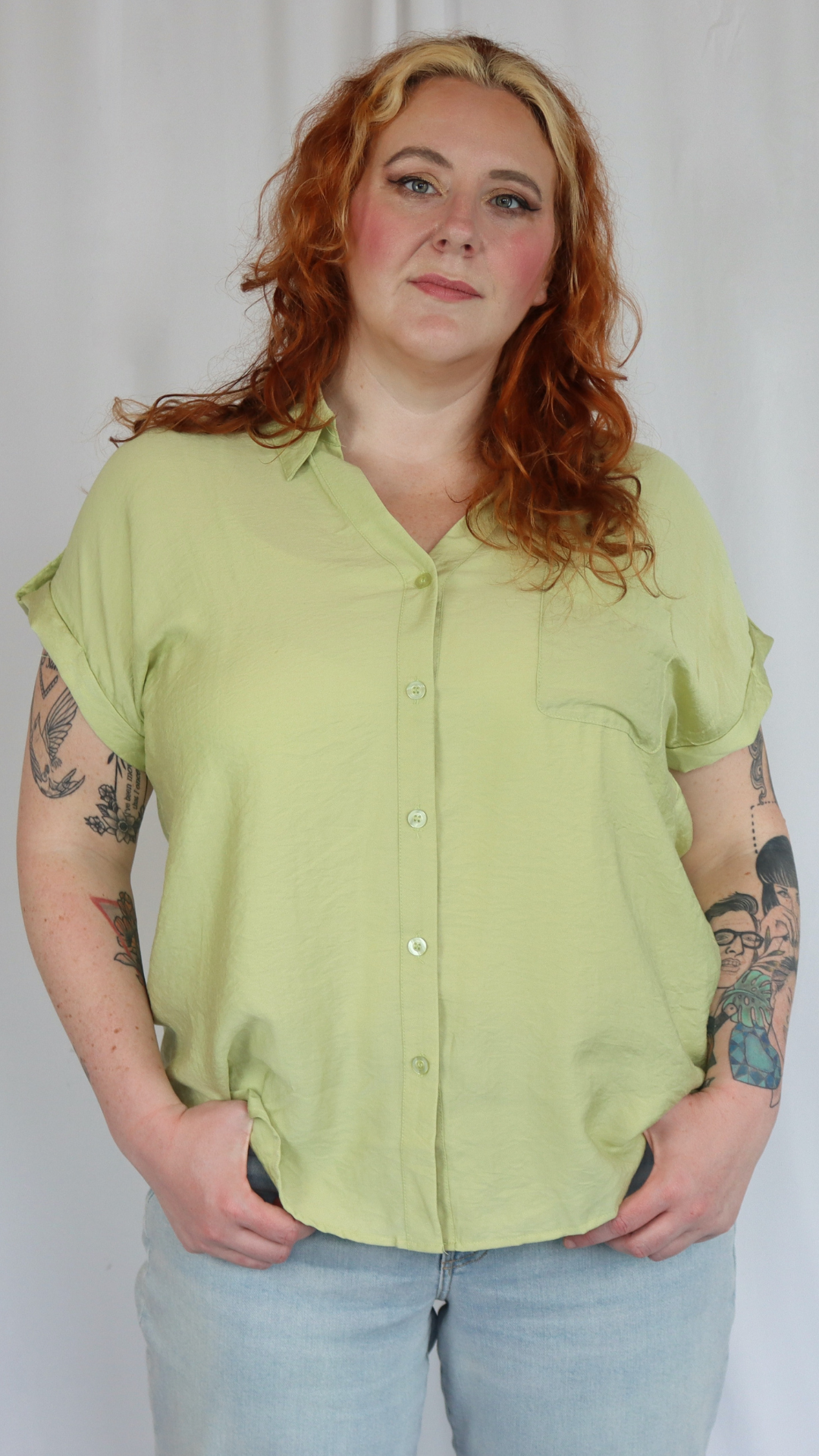 Plus size light green button down shirt.