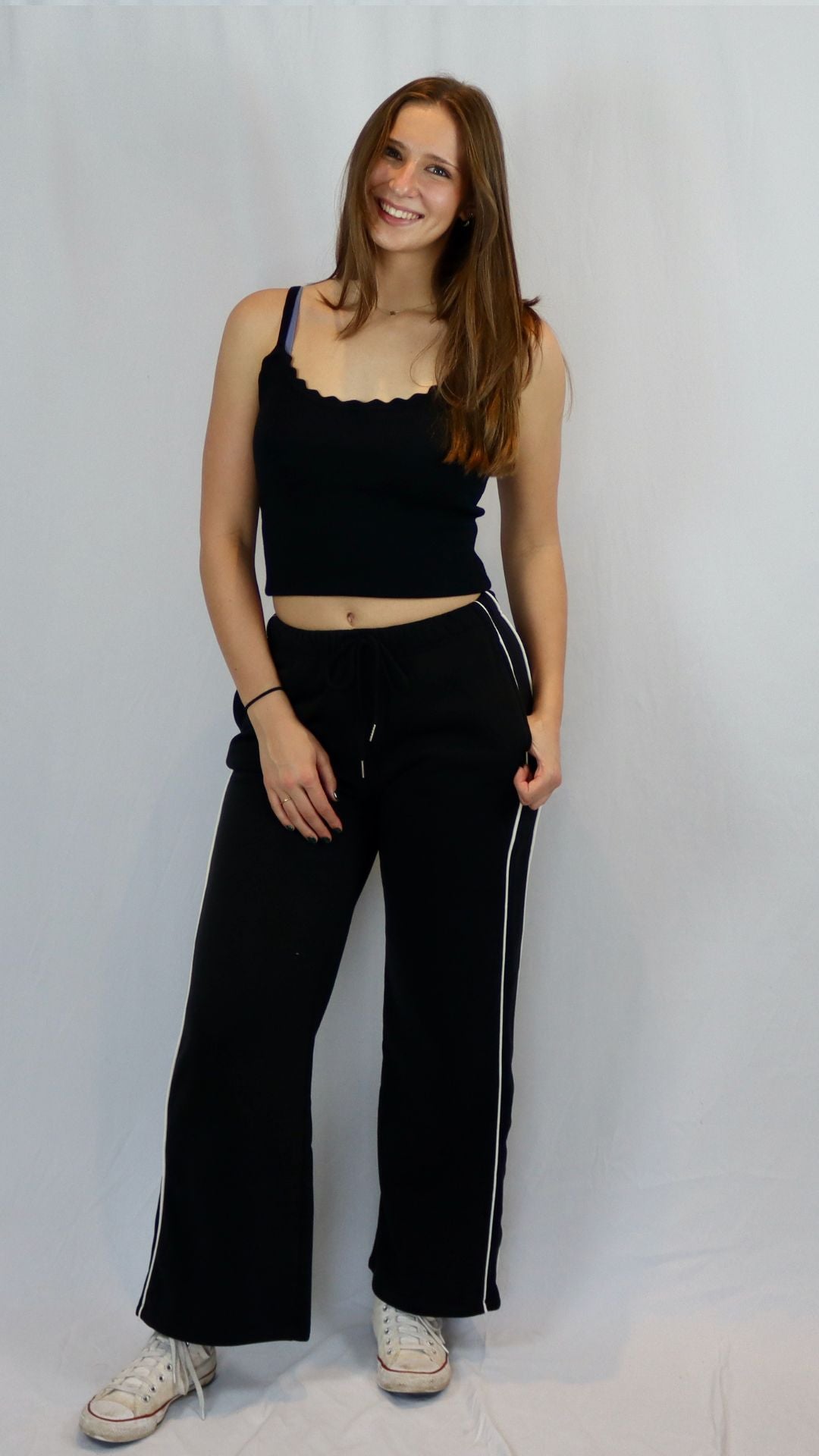 black wide leg sweatpants with white stripe down the side