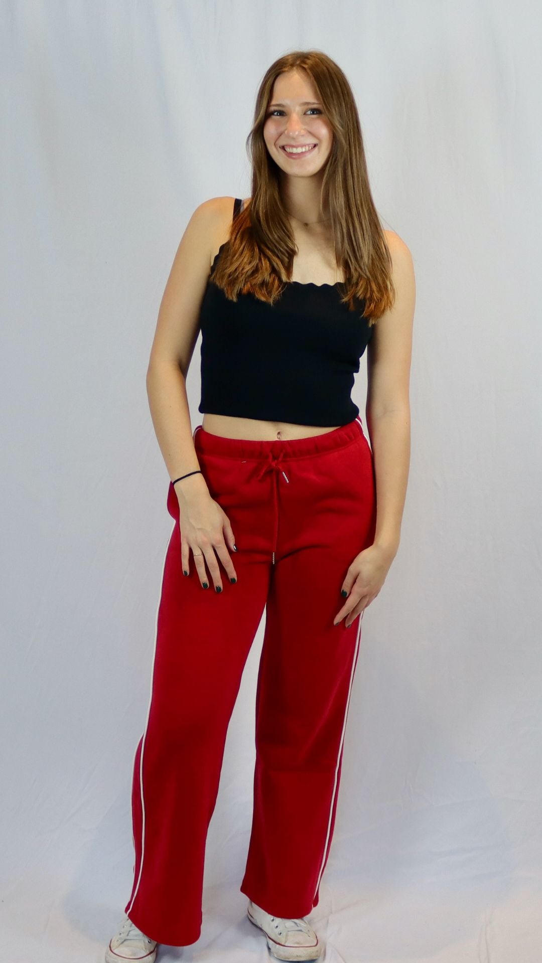 red wide leg sweat pants with white stripe down the side