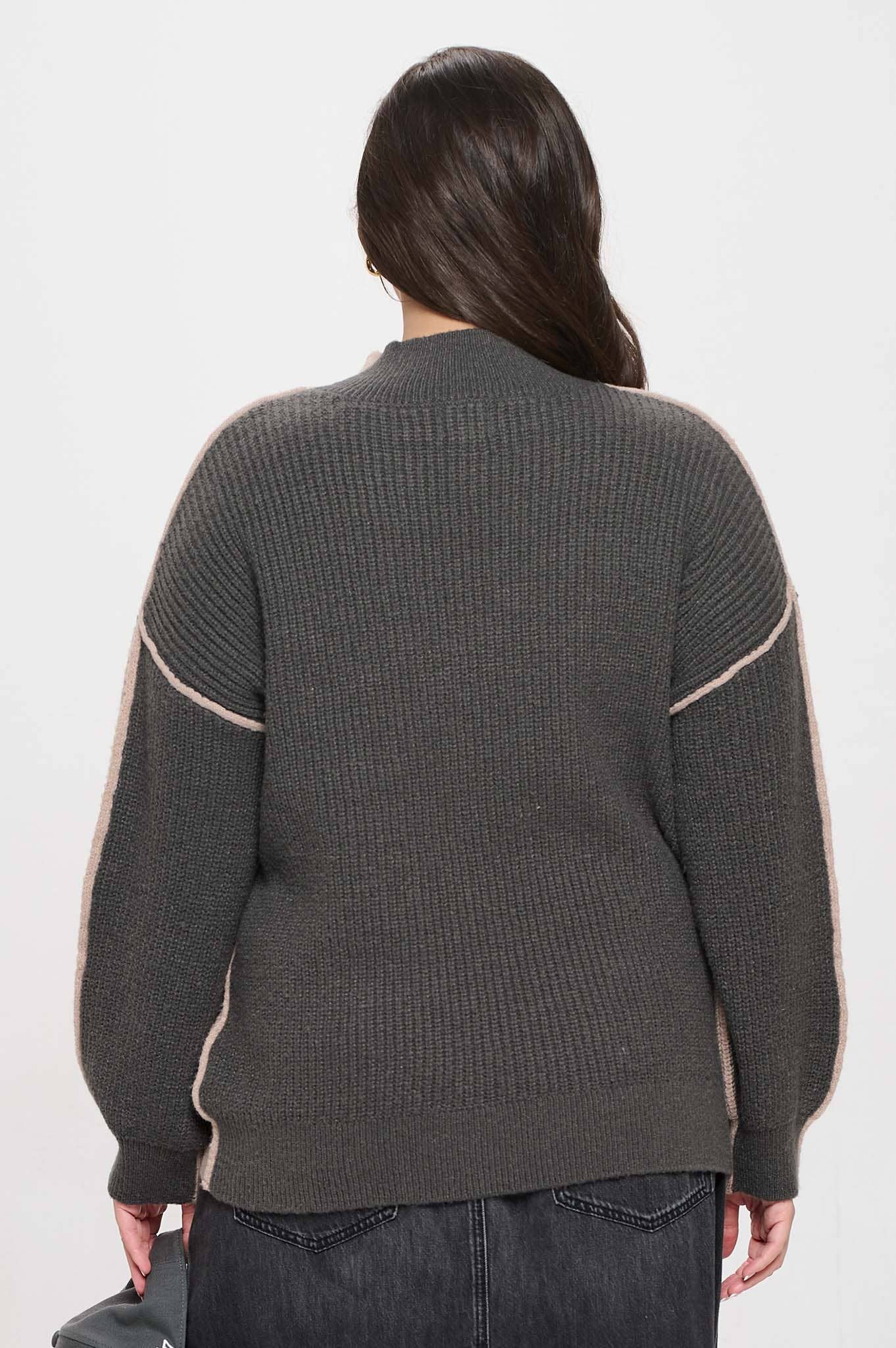 Plus-size colorblock mock neck sweater with exposed seams