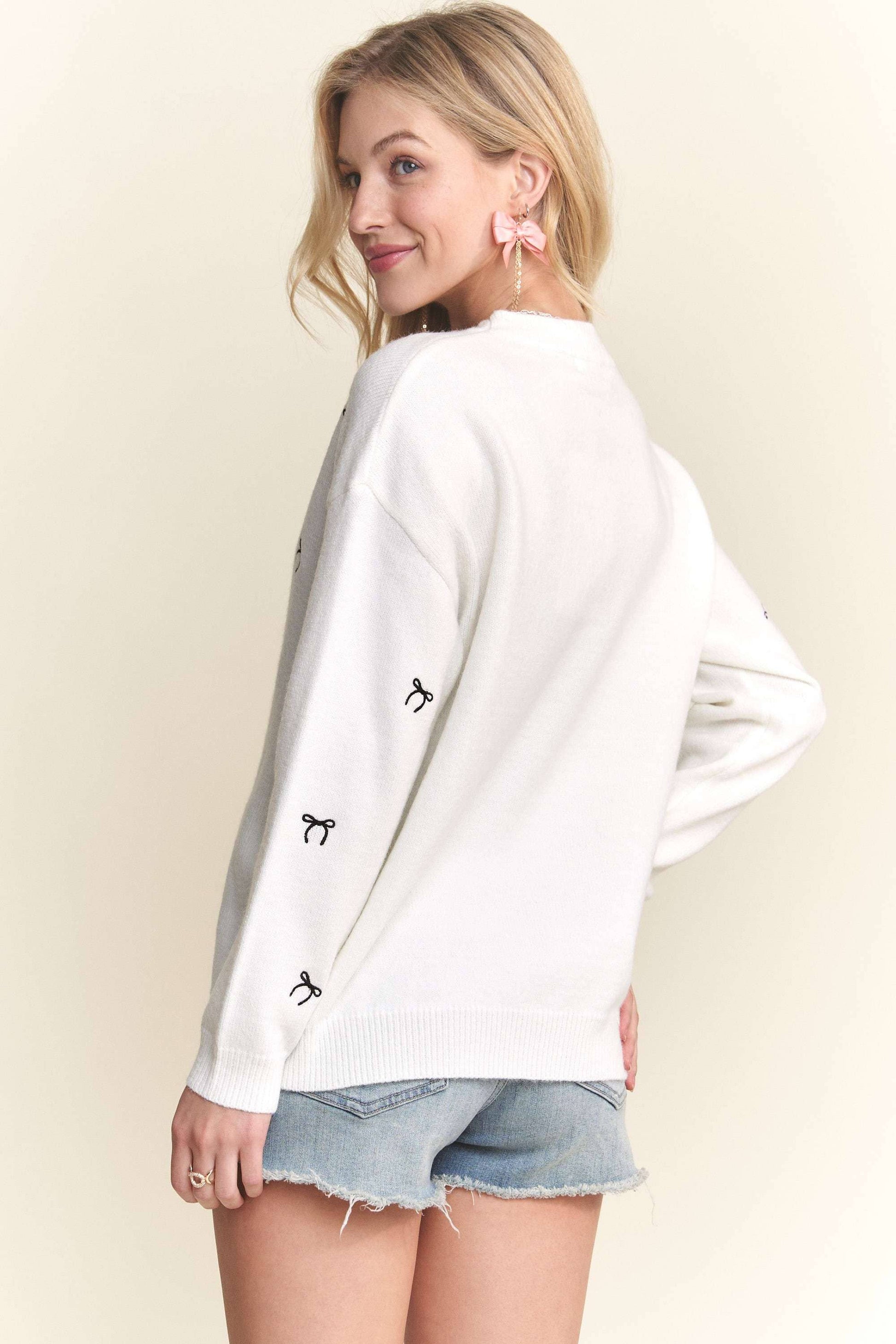 Soft knit sweater with bow embroidery for a feminine touch