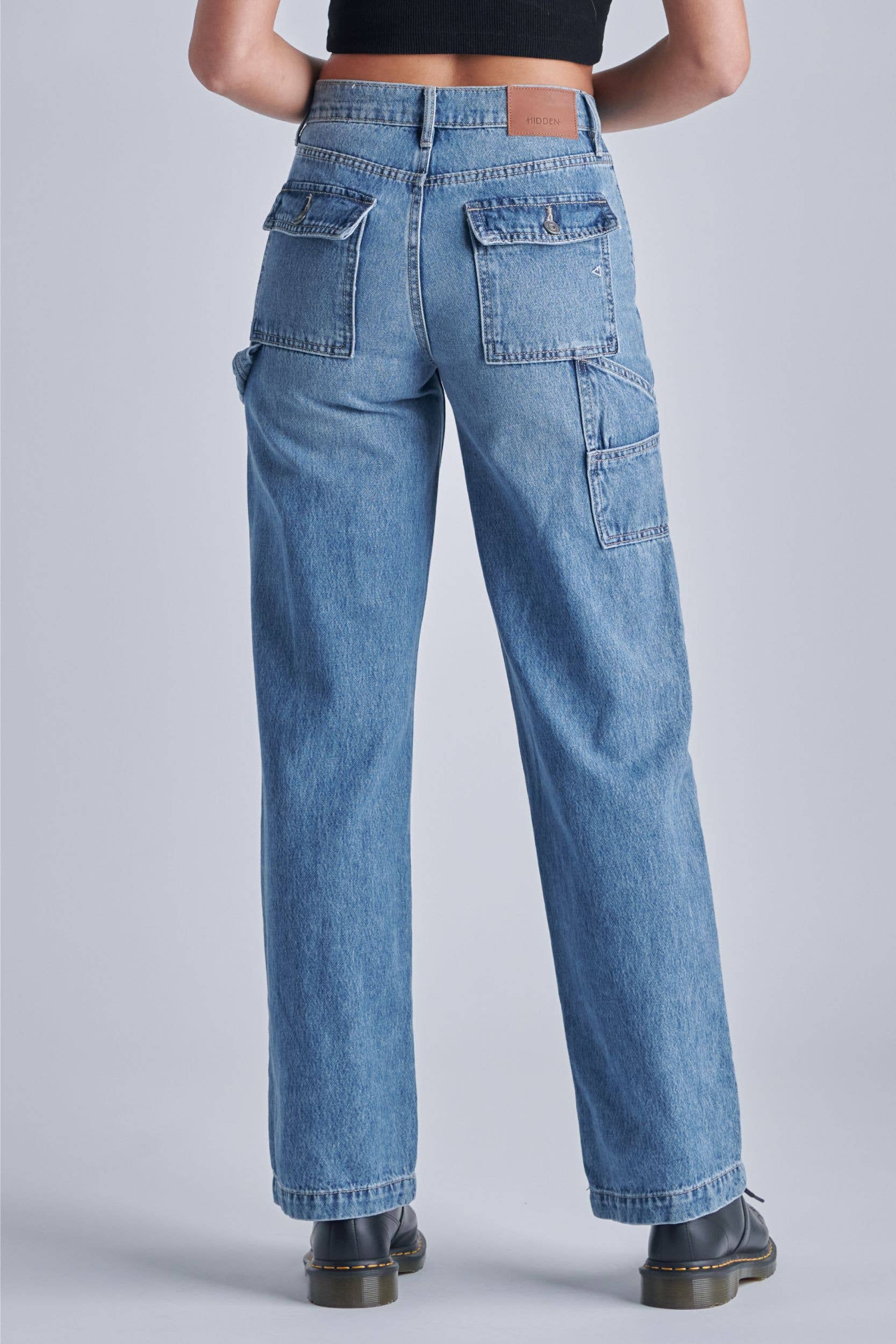 Light wash carpenter dad jeans with a loose fit and pockets