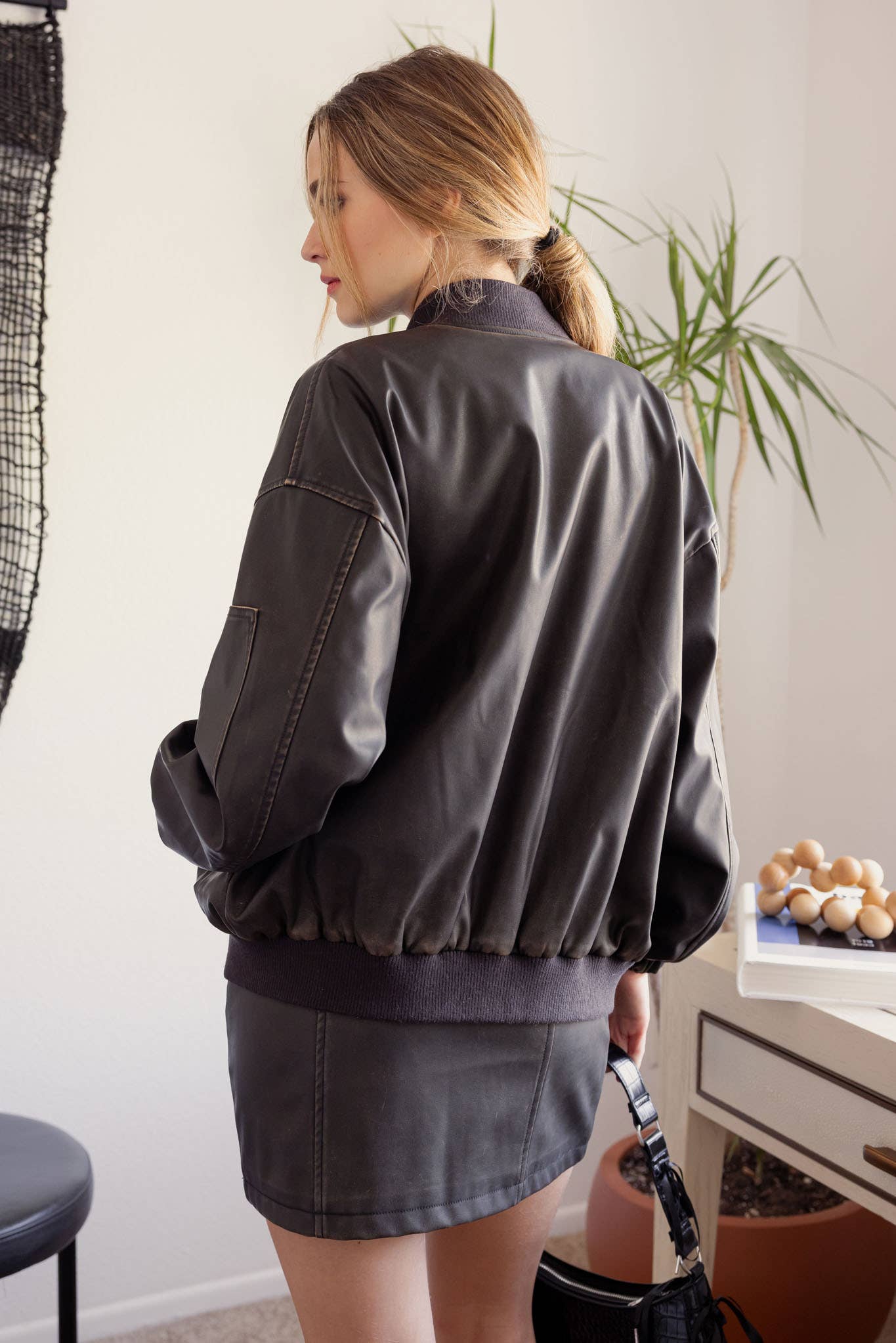 Oversized faux leather bomber jacket for street-style looks