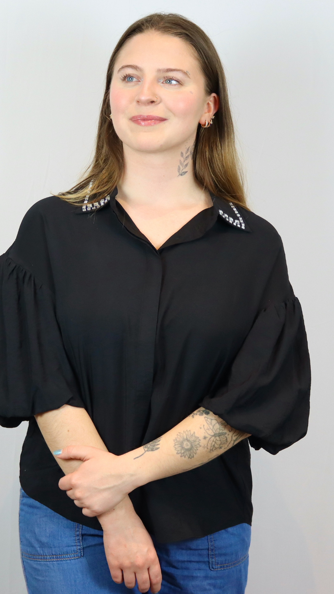 Textured black short-sleeve blouse with a relaxed fit and rhinestone-embellished pointed collar.