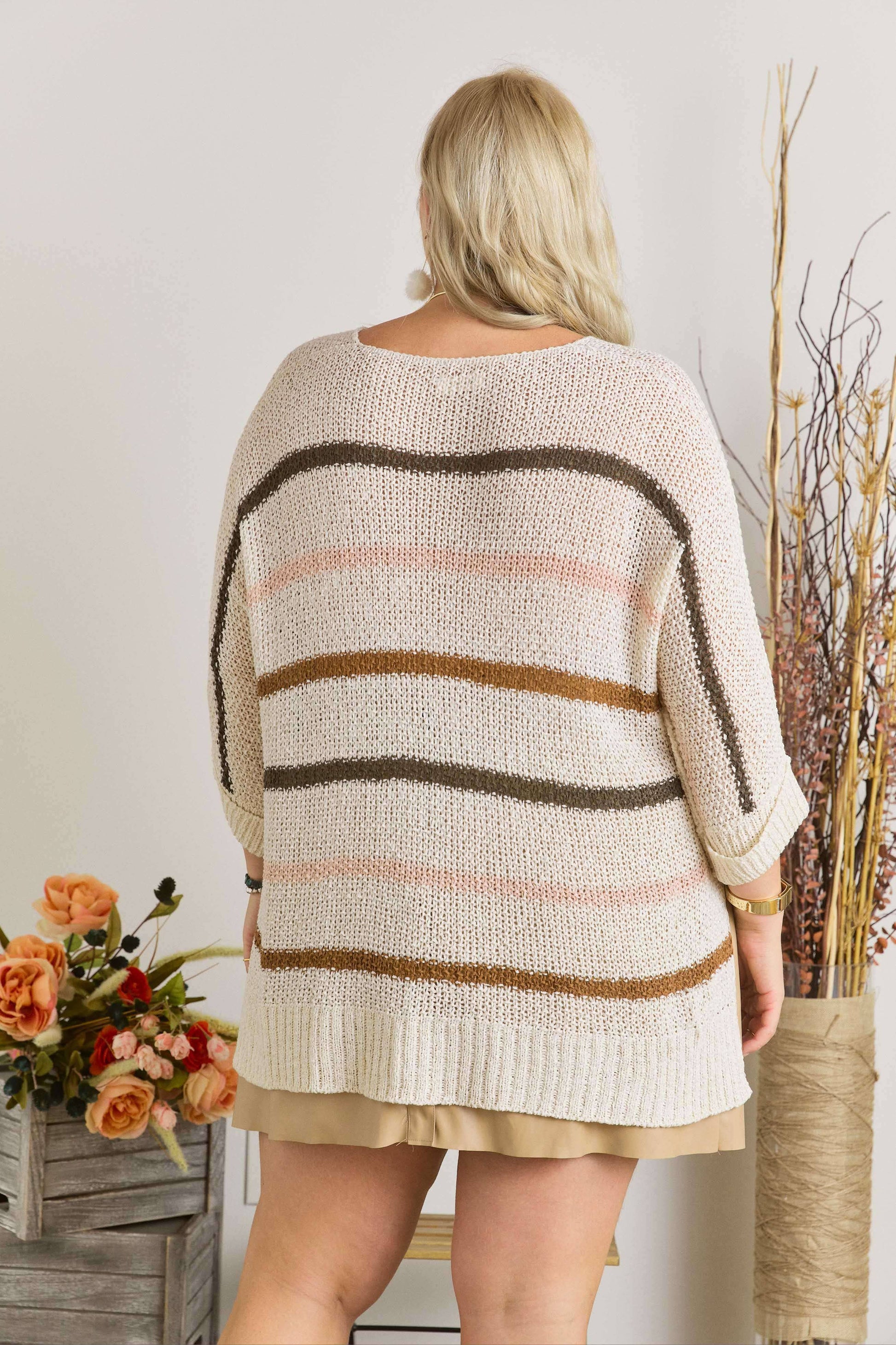 Plus size striped sweater with a relaxed fit and bold stripes