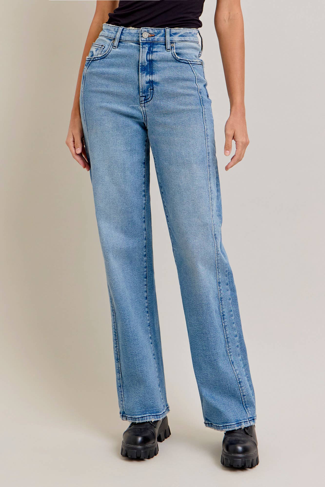 Medium wash stretch dad jeans with curved seam design